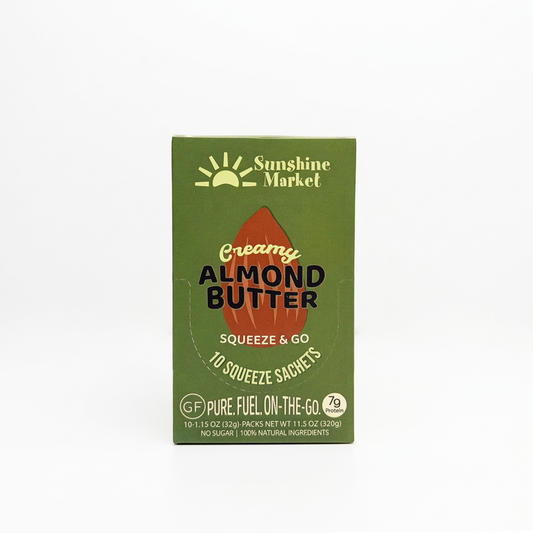 Sunshine Market Creamy Almond Butter Squeeze & Go packaging box in olive green, 100% natural almond butter