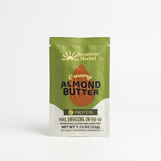 A single stand-up pouch of Sunshine Market Creamy Almond Butter protein powder, featuring a green and white design with an almond graphic, on a clean white background.
