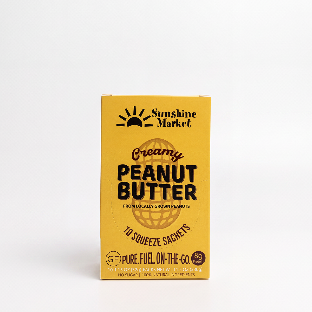A yellow box of Sunshine Market Creamy Peanut Butter 10 squeeze sachets, 100% natural peanut butter