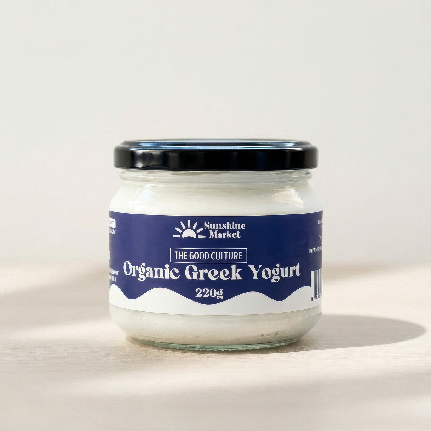Jar of Organic Greek Yogurt with Sunshine Market label on a white background